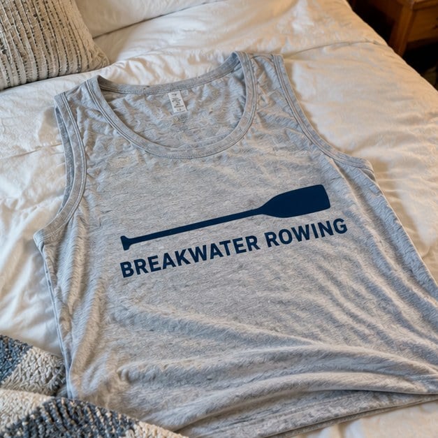 Customer photo of a custom tank top on a bed